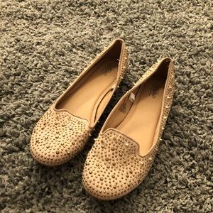 Tan and gold spiky flats